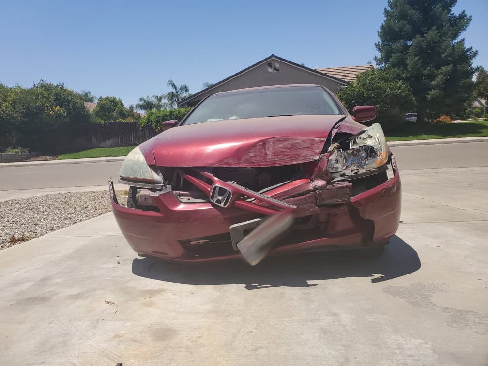 $100K de Indemnización por Colisión Frontal