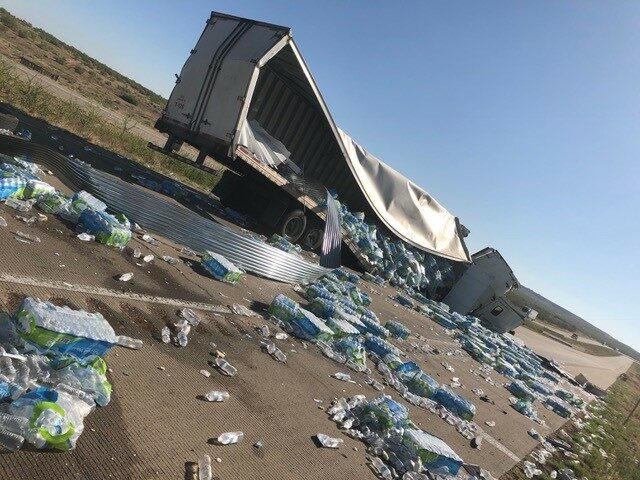 $125K por Colisión con Camión Freightliner